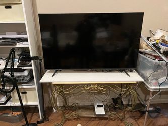 55” Smart TV  (2025) with stand and remote.