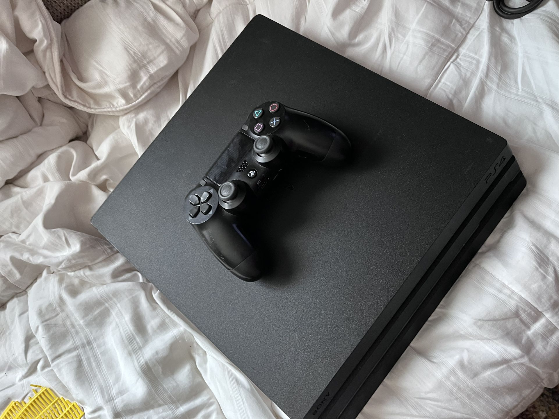 PS4 pro With Cords And A Controller