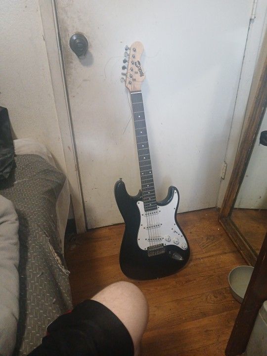 Used Black Electric Guitar