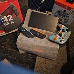 Brand New Nintendo Swtch 2 With Mario Cart Game And Hard Plastic Carring Case And Mario Controller