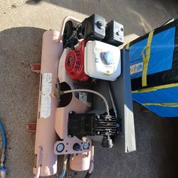 a Ridgid gas-powered air compressor. It is powered by a Honda GX 160 OHV engine, which is a 5.5 HP engine known for its reliability and durability. 