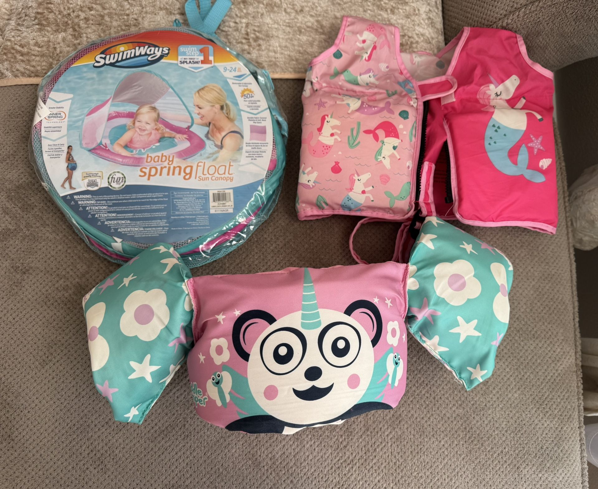 Baby girl pool floaty and safety vests