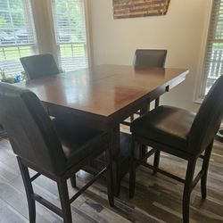 Ashley Haddigan Counter Height Dining Table with 6 Leather Barstools, W/Leaf, and Storage.