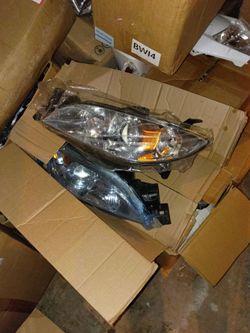 headlight assemblies designed for 2005-2006 Toyota Camry models, typically fitting the LE or XLE trims.