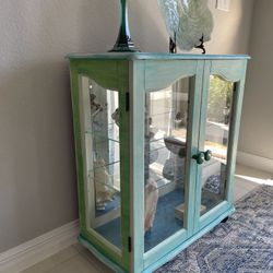 Artistic painting of a coastal style floor cabinet