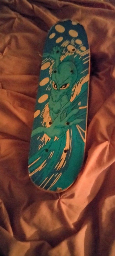 Little Boys Skateboard Blue And White With A Picture On It