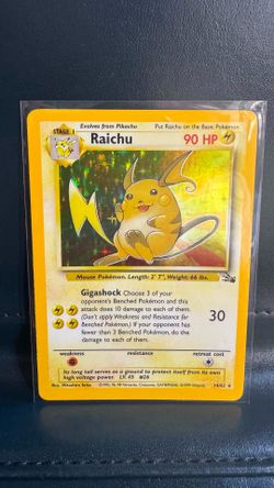 1999 Pokémon Fossil Set Raichu card (14/62), featuring a holofoil artwork illustrated by Mitsuhiro Arita.