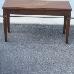 Vintage Walnut Organ Piano Bench With Flip Top Storage Compartment Compartment. Used in good condition with some minor cosmetic blemishes. These blemi