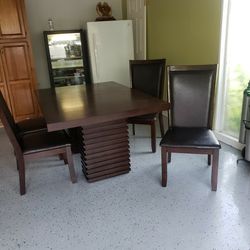 dining table with 4chairs. Dark brown wood. 300 hundred dollers