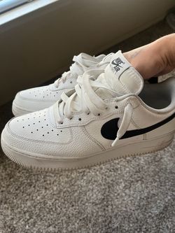 White Air Force 1’s with Black Nike swoosh