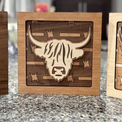 “Layered Highland Cow Art in Plywood Form”