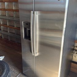 GE side-by-side refrigerator with water and ice dispenser