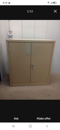Solid metal storage cabinet with key