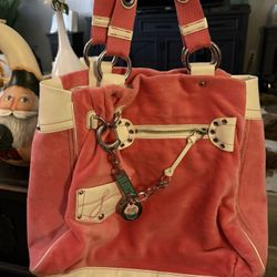 Vintage pink Juicy Couture tote bag with a "Cupcake" charm. 