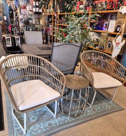 New 3 piece outdoor wicker style patio set. Two chairs and side table