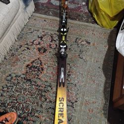 Skis And One Snowboard