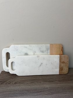 Two stunning stone and wood serving boards