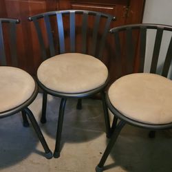 3 matching swivel stools