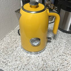Cute yellow electric tea kettle