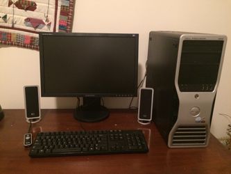 Monitor, speakers, and desktop combo