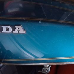 Vintage green Honda motorcycle gas tank