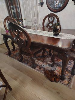 Very high end table and four chairs with a leaf