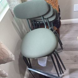 Four green kitchen table chairs