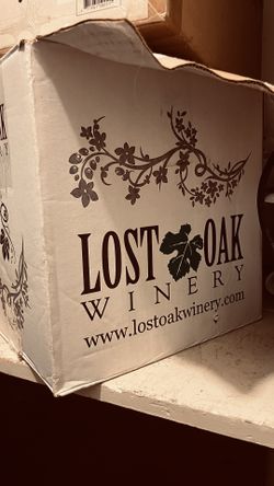 Empty clear, wine/kombucha bottles