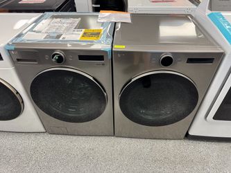 Grey LG Washer 4.5 cu ft and 7.4 cu ft Electric Dryer Set. Units are new open box scratch and dent