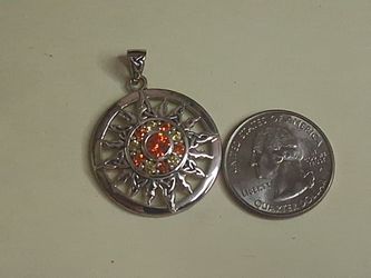 Silver Sun Pendant with Orange Stones