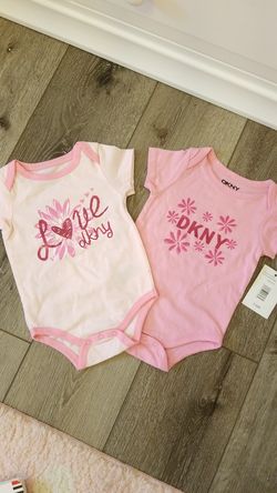 New pink DKNY onesie size 3-6 months