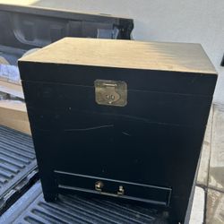Black antique cabinet with drawer