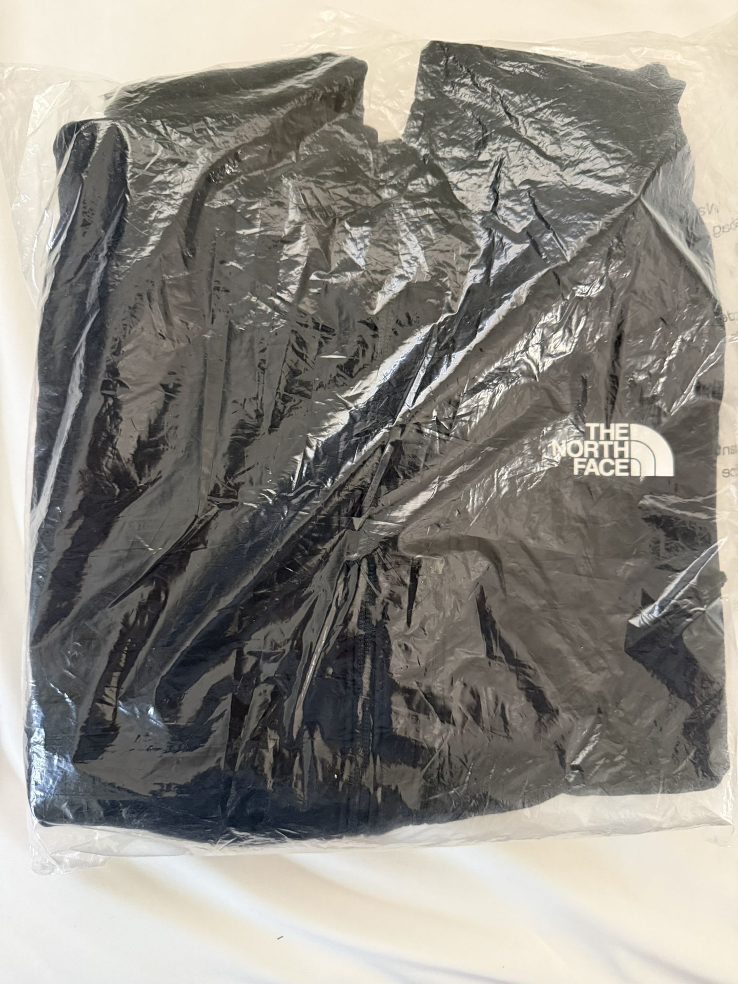 The North Face black windbreaker jacket