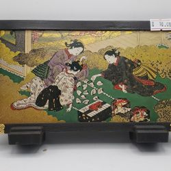 A vintage Japanese lacquer or paper-mâché tabletop screen or decorative box panel
