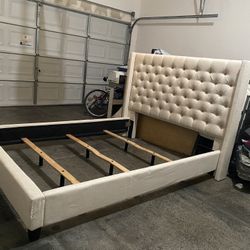 CREAM COLORED CUSHIONED QUEEN SIZE BED FRAME 