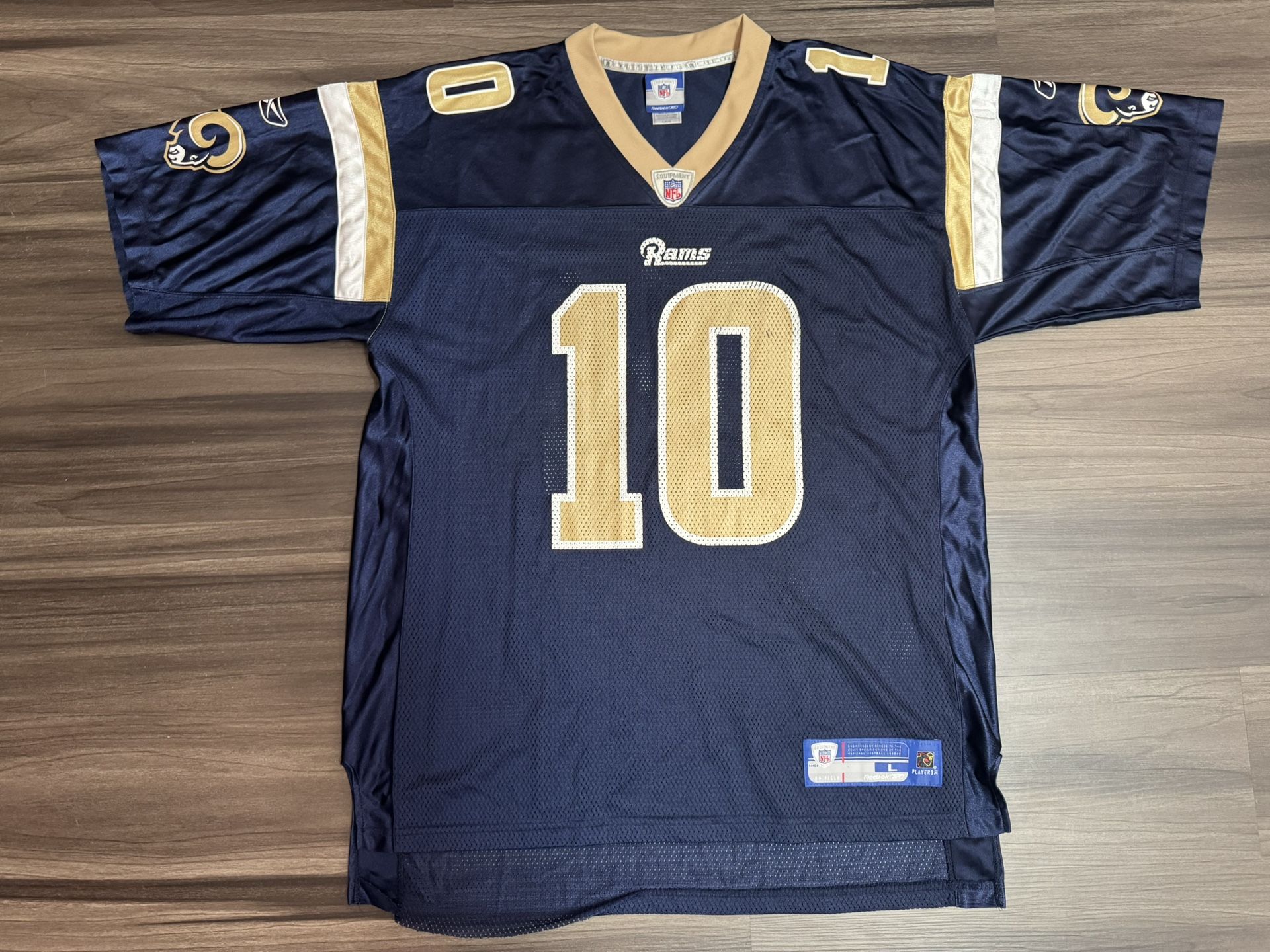 Reebok St. Louis Rams Marc Bulger 10 NFL Equipment Blue Gold Home Jersey Men’s L  100% authentic. Good condition.   This product is a Reebok St. Louis