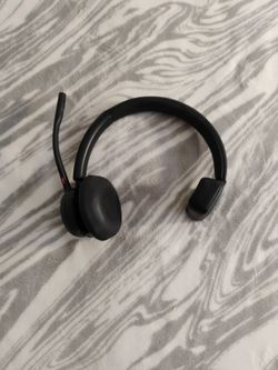 Poly (formerly Plantronics) Voyager 4310 wireless noise-canceling single-ear headset.