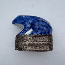 Vintage blue and white ceramic frog trinket box with ornate metal base