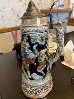Vintage German beer stein with music box