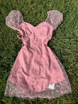 Woman’s pink dress