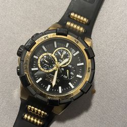 Invicta black and gold watch