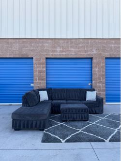 Charcoal grey sectional sofa couch with ottoman