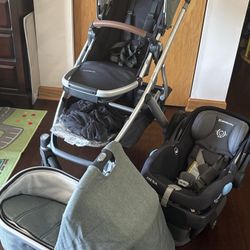 Uppababy stroller, car seat, and bassinet.