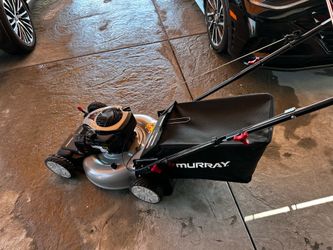 New Murray lawn mower has 140cc Briggs & Stratton engine. Features 22-inch cutting width and is self-propelled with front wheel drive. Includes grass 