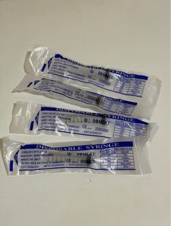 DISPOSABLE SYRINGE