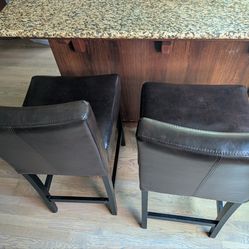Two leather bar stools