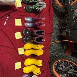 Various Size And Brands Of Boots 