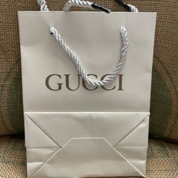 Médium Gucci shopping bag.  rope handles. 14" by 10".smoke free