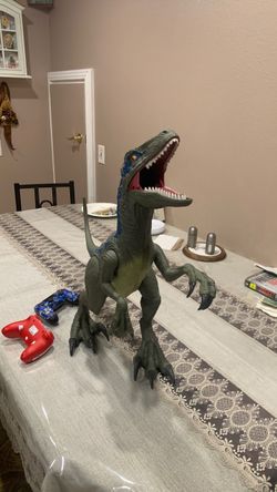 Dino sour and 2 controllers one Nintendo switch controller and a ps4 controller