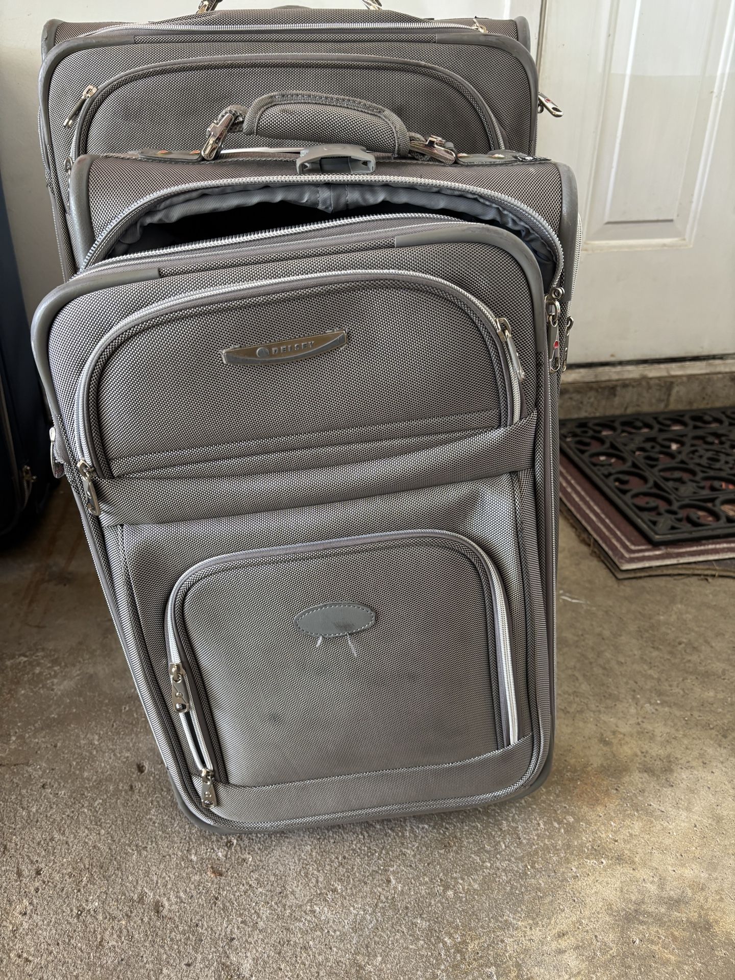 Two Full Size, Two Carry On Suitcases (used)